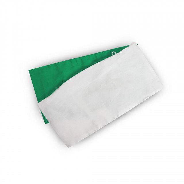 A green and white piece of cloth on a white surface
