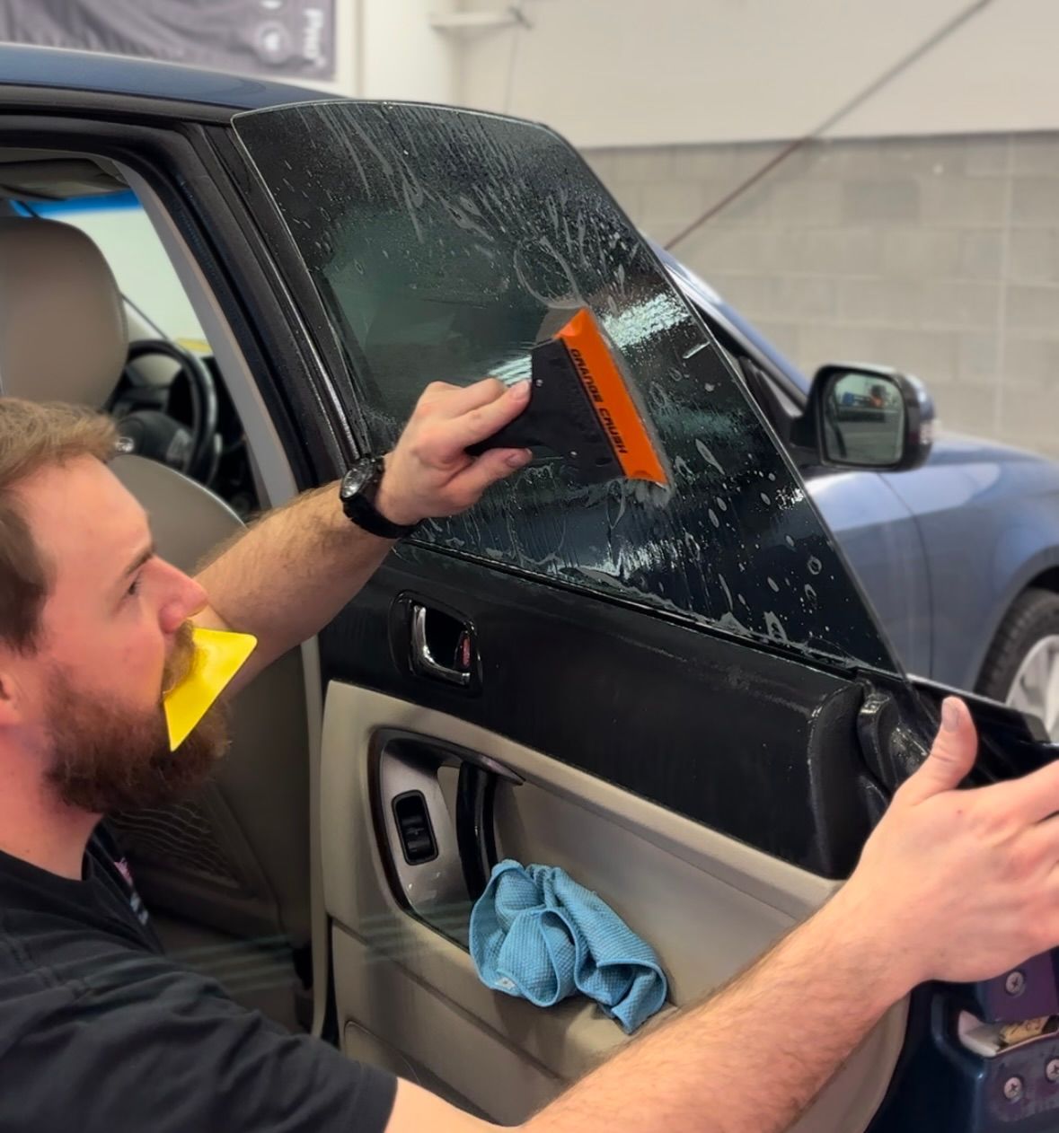 Subaru gets a window tinted at Stokes Auto Spa near Provo, Utah.