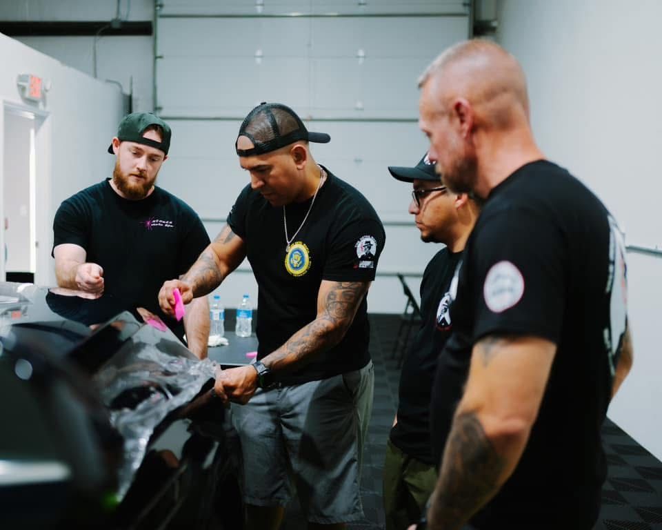 Britt Stokes instructing ppf students on correct installation techniques for a successful install of clear bra.