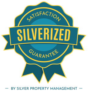 Teal and gold “Silverized” satisfaction guarantee badge by Silver Property Management