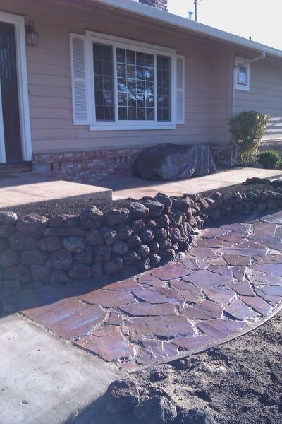 A house with a stone walkway in front of it