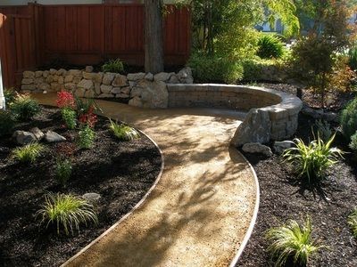 A path leading to a fire pit in a garden
