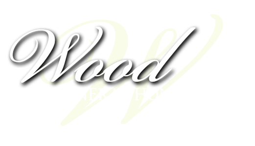 Stylized silver script reading “Wood” on a white background with a faint yellow shadow