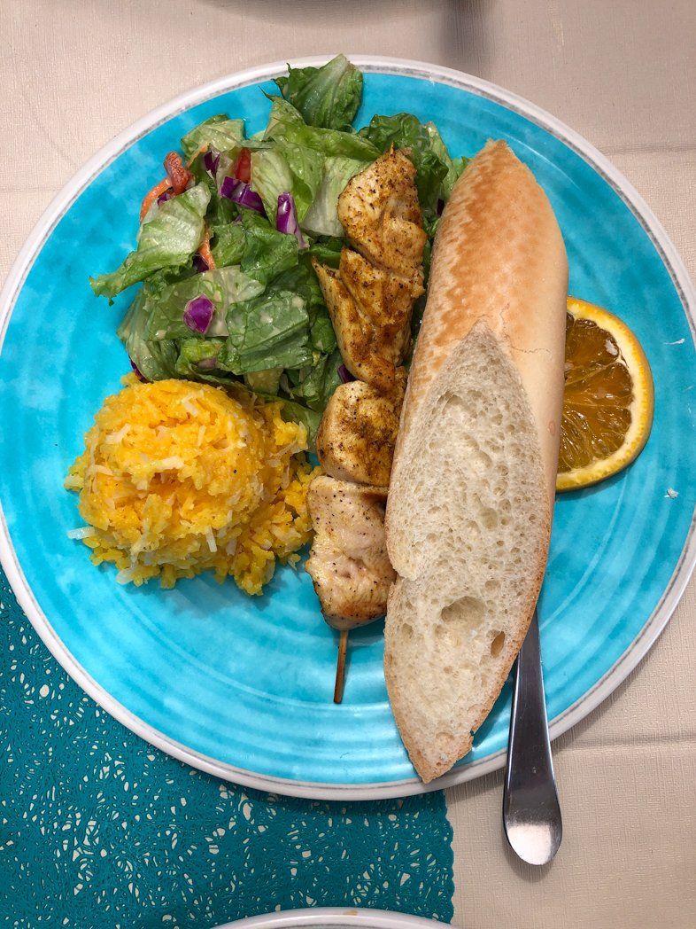 Grilled chicken lunch served on Random Wind tours