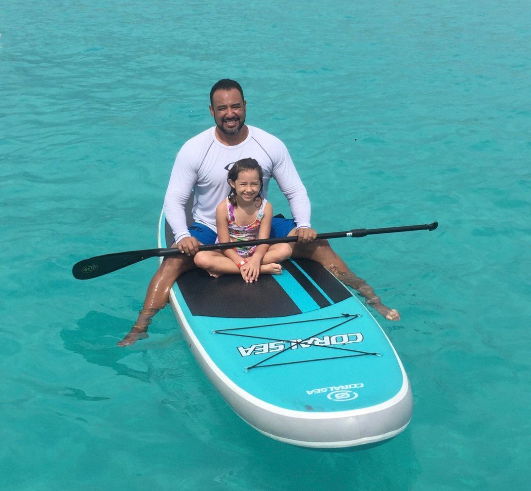 Father and daughter on a paddle boat in St Maarten