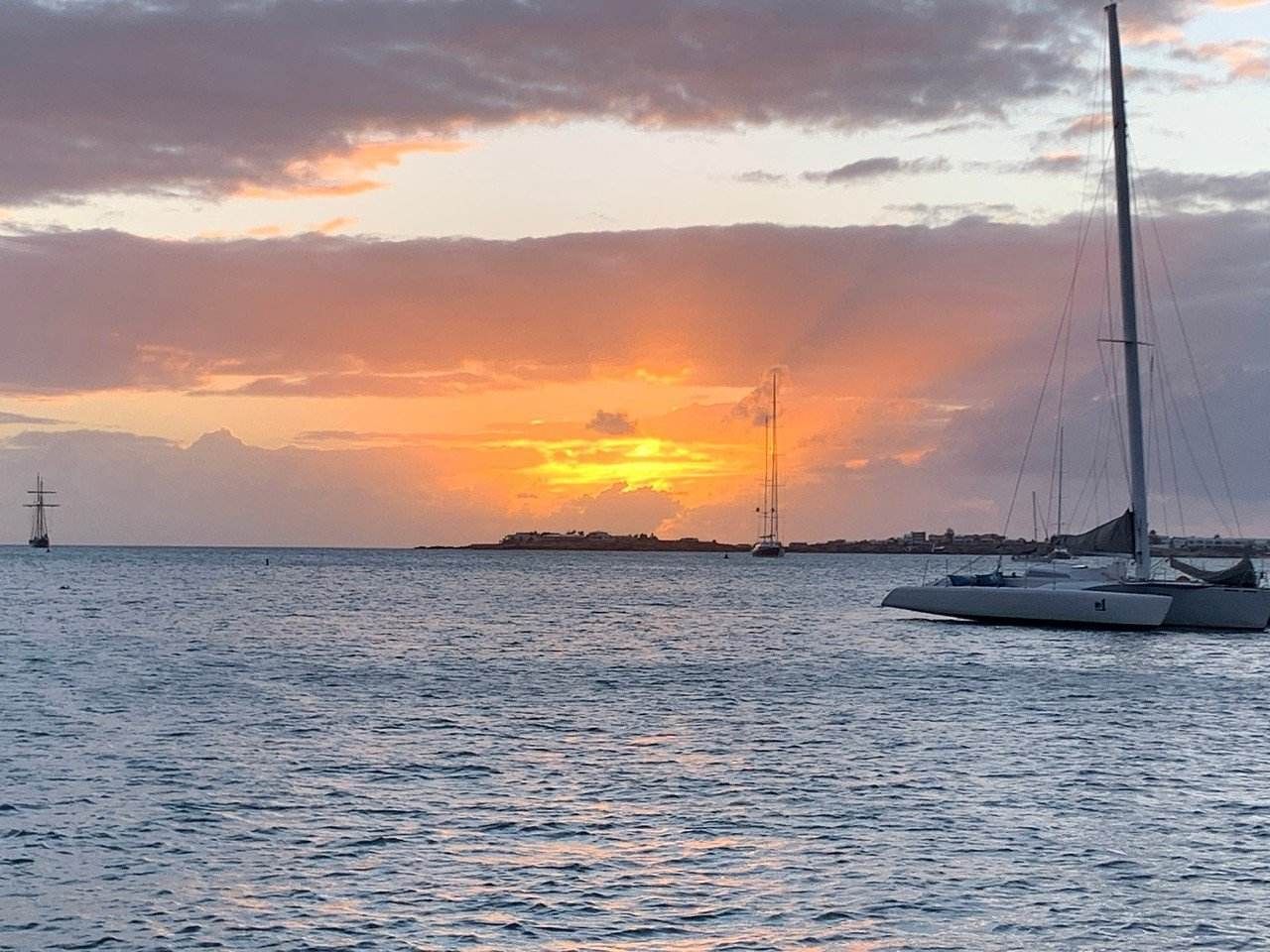 Yacht Random Wind at anchor during sunset in Sint Maarten 