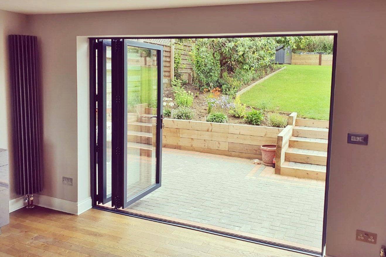 Double glazed BY-FOLD doors installed at domestic property near Sudbury, Suffolk by Suffolk Doors and Windows