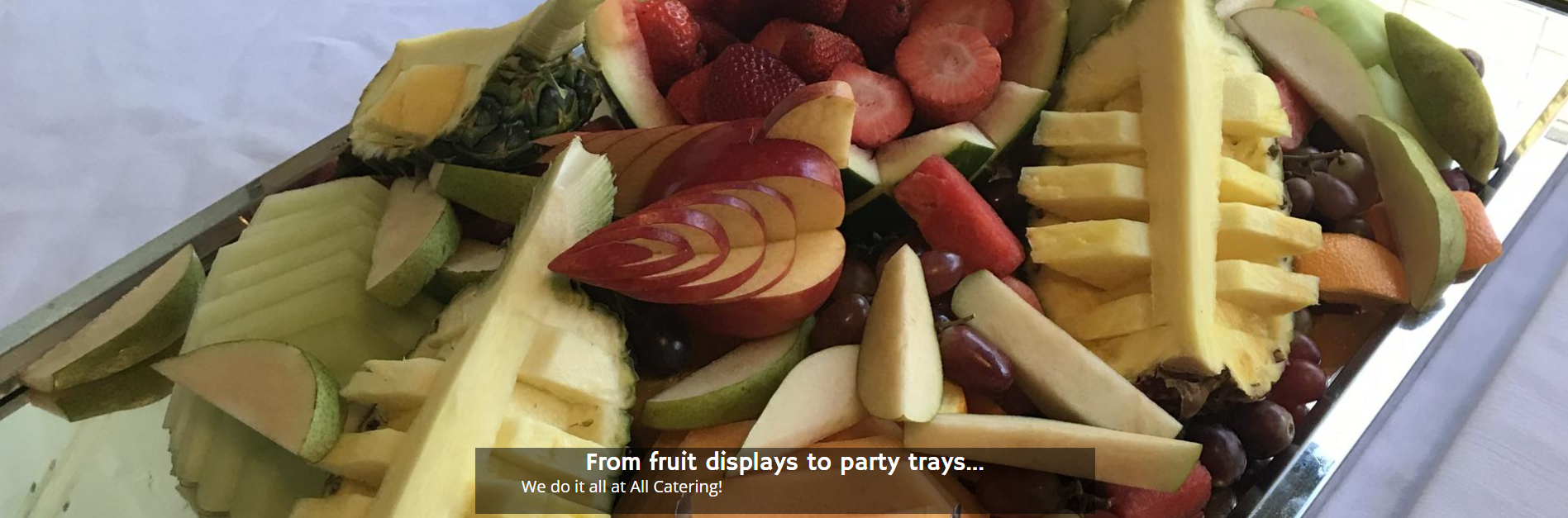 Platter of sliced fruits and vegetables, including melon, strawberries, kiwi, and celery