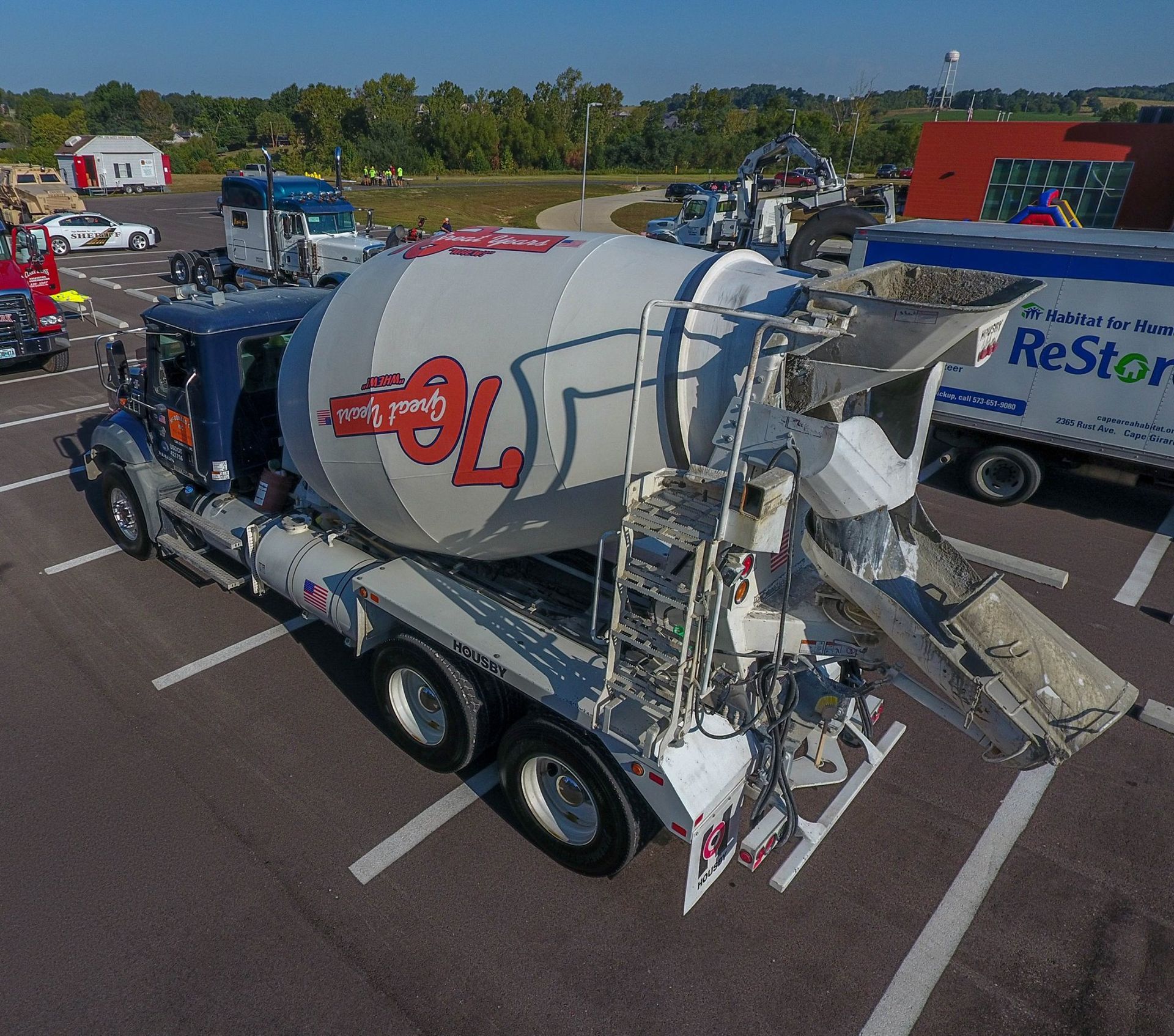An aerial view of a mixer truck in a parking lot