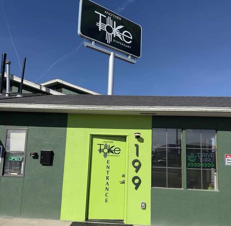 Another Toke Dispensary - Light Green Front Entrance the rest of the building is dark green