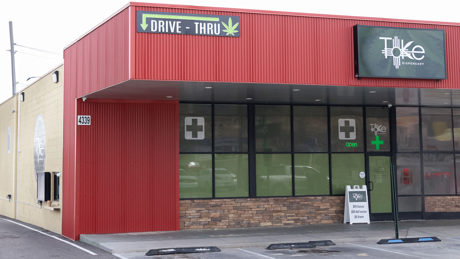 Toke drive-thru window, and medical cross symbols on the windows.