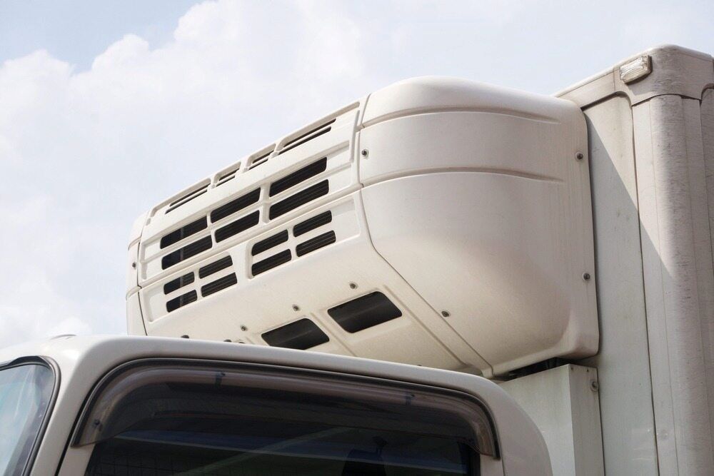 A White Truck With a Refrigerator on Top of It — Complete Airconditioning & Refrigeration in Darwin, NT
