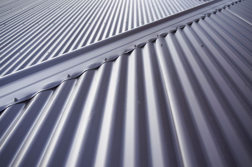 A Close Up of a Metal Roof With a Diagonal Pattern — Wagga Roof Repairs In Mount Austin, NSW