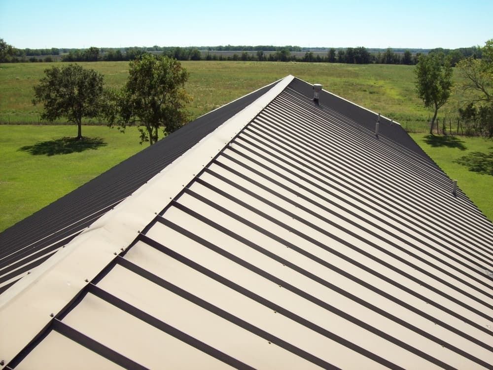 An Aerial View of a Roof With Trees in the Background — Wagga Roof Repairs In Mount Austin, NSW