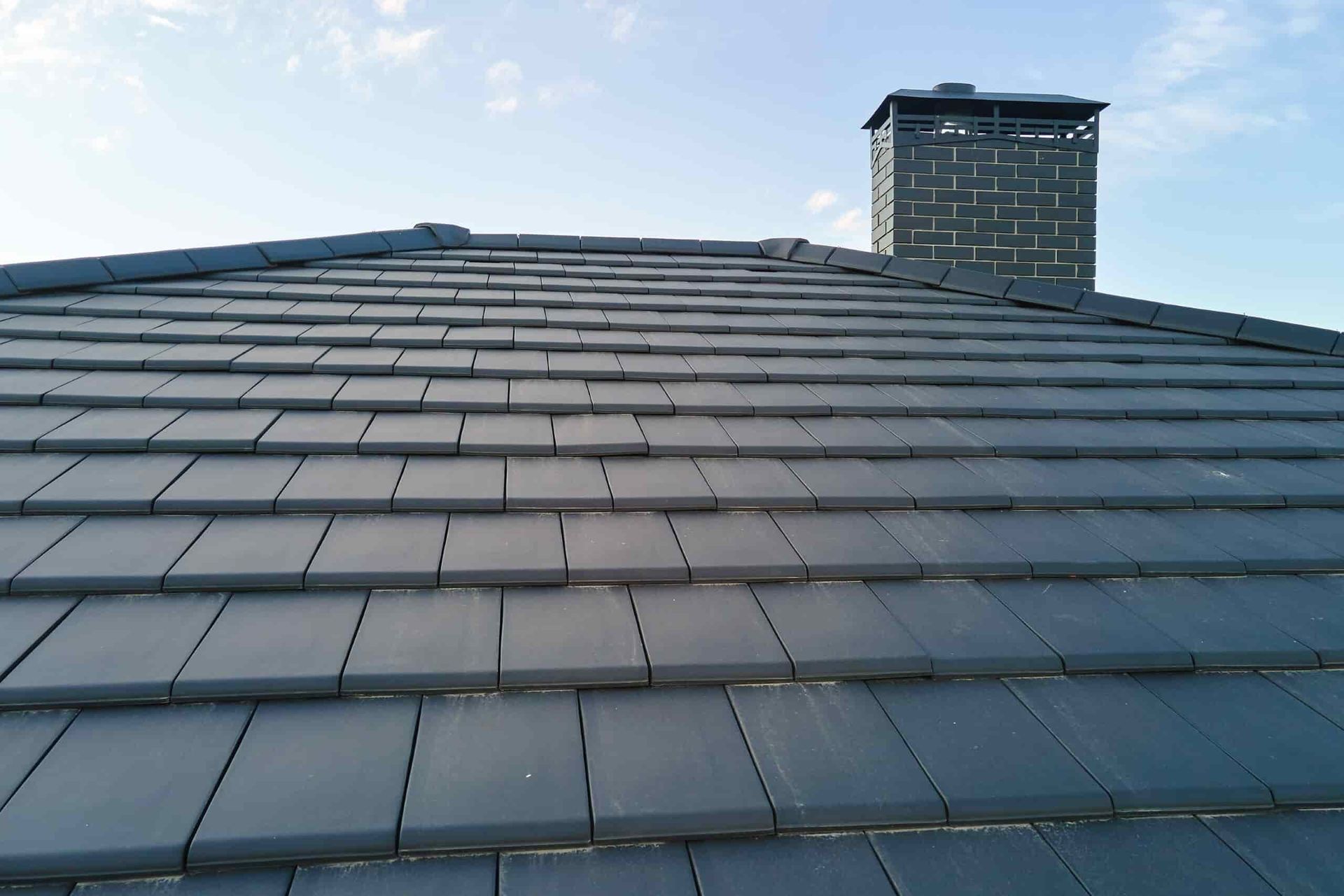 A Roof With a Chimney on Top of It — Wagga Roof Repairs In Mount Austin, NSW