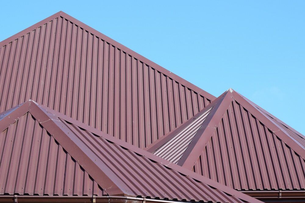 A Brown Roof With a Blue Sky in the Background — Wagga Roof Repairs In Tumut, NSW