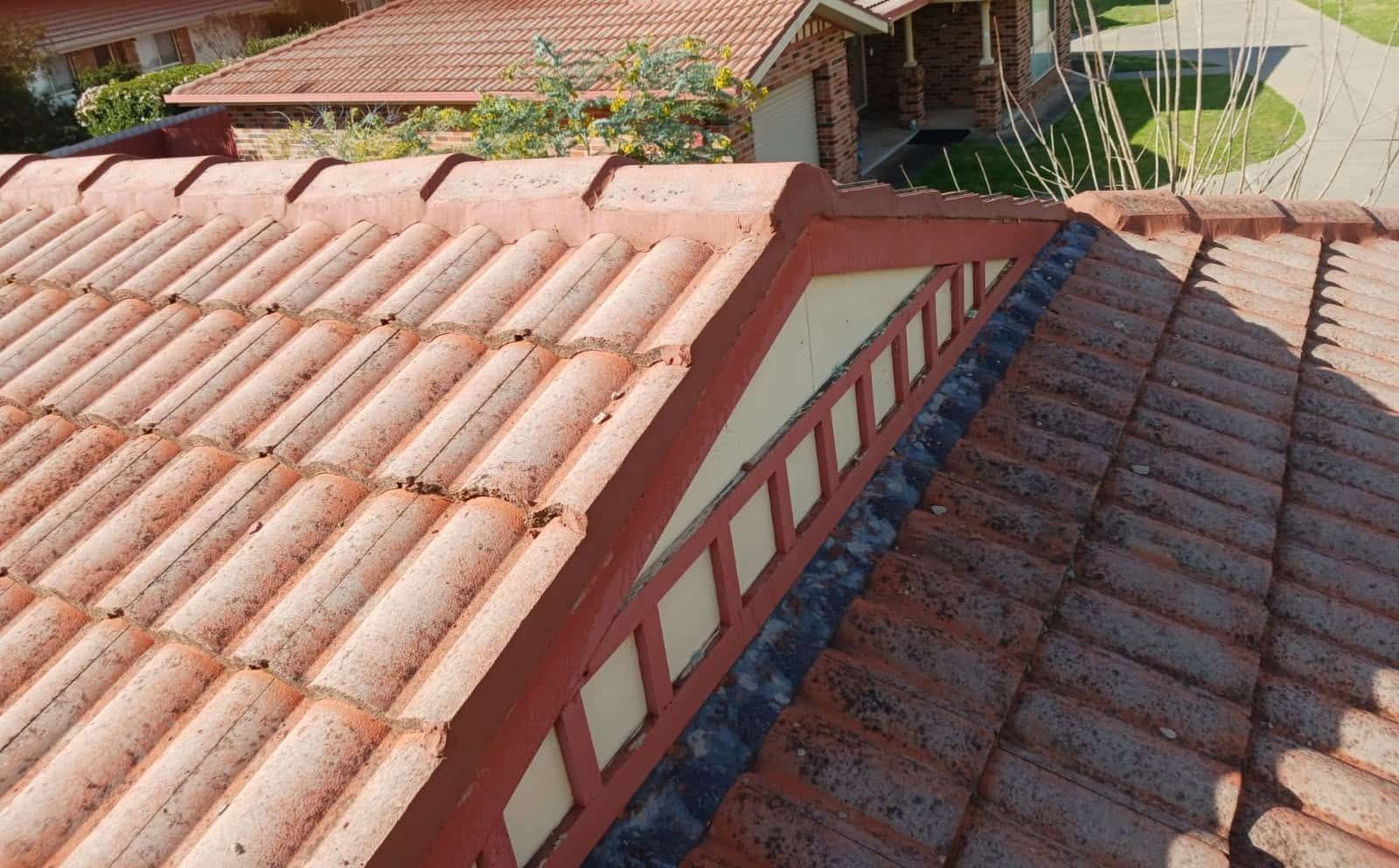 A Close Up of a Roof With Wooden Tiles on It — Wagga Roof Repairs In Mount Austin, NSW