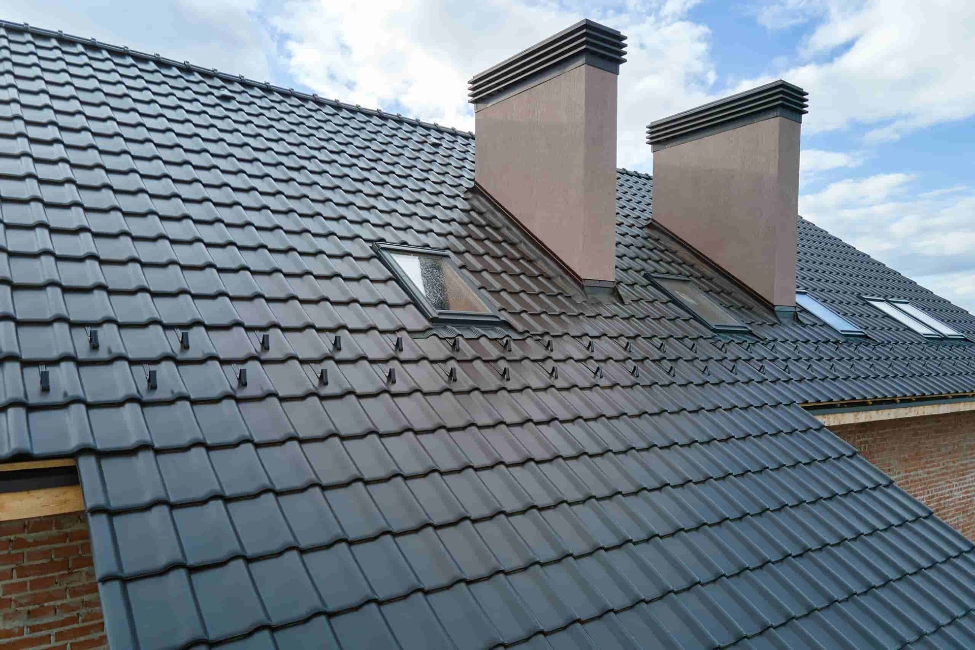 A Roof With a Lot of Tiles and Chimneys on It — Wagga Roof Repairs In Mount Austin, NSW