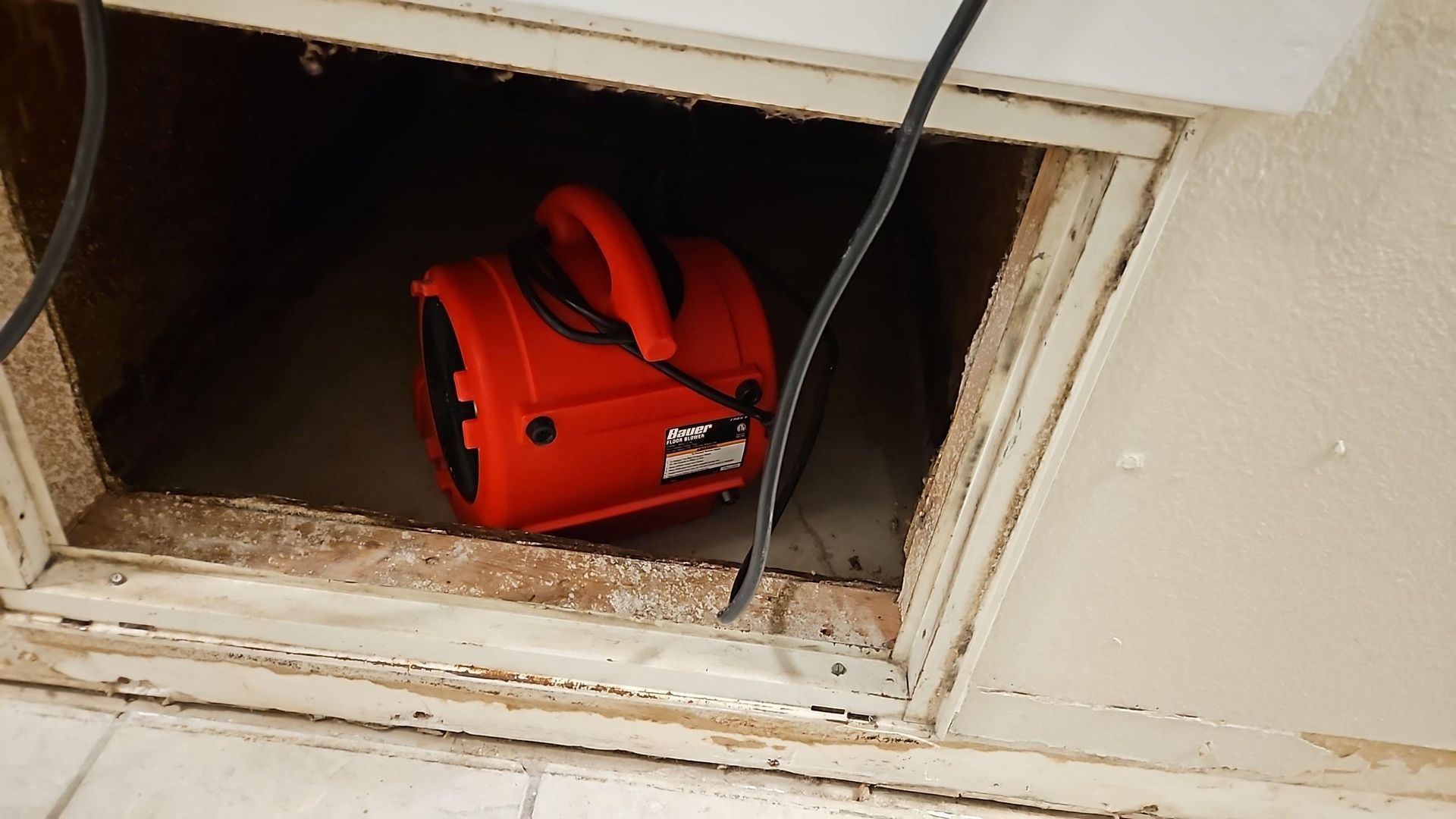 Drying equipment set up in AC closet during water damage mitigation