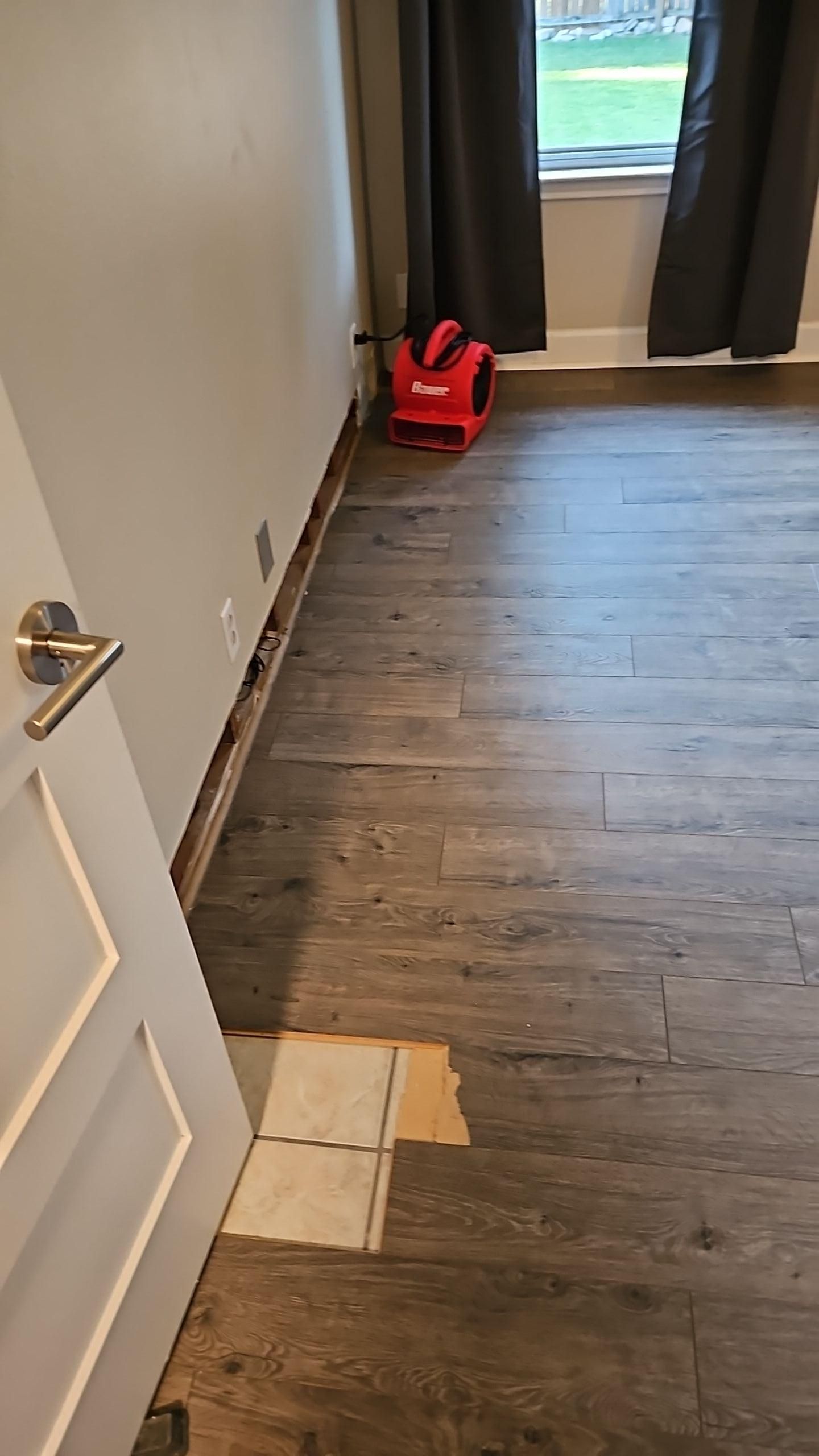 Bedroom water damage drying with air movers and dehumidifier