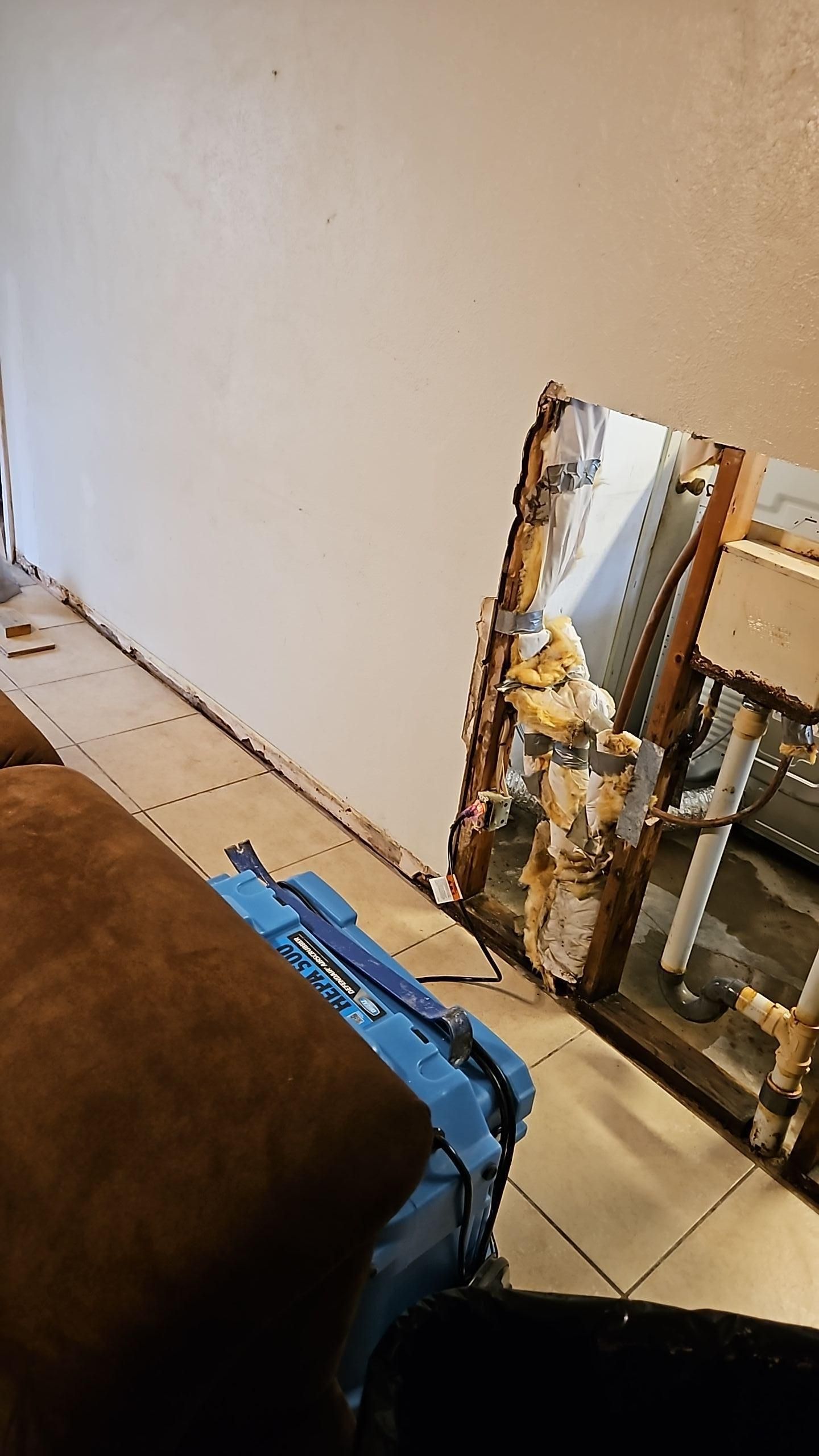 Drying equipment operating in garage after broken pipe water damage removal