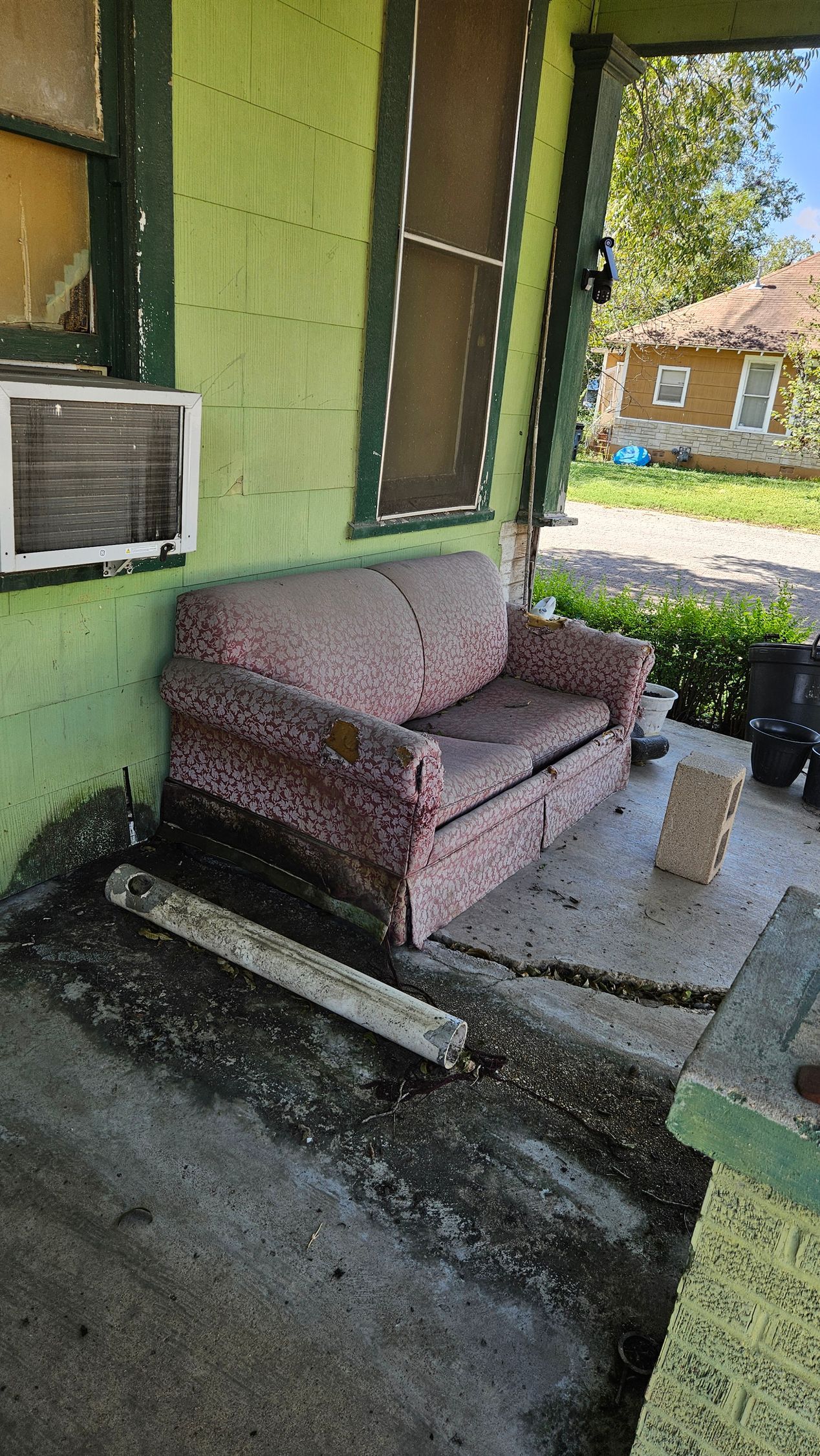 Damaged furniture and items staged for removal during Waco clean-out