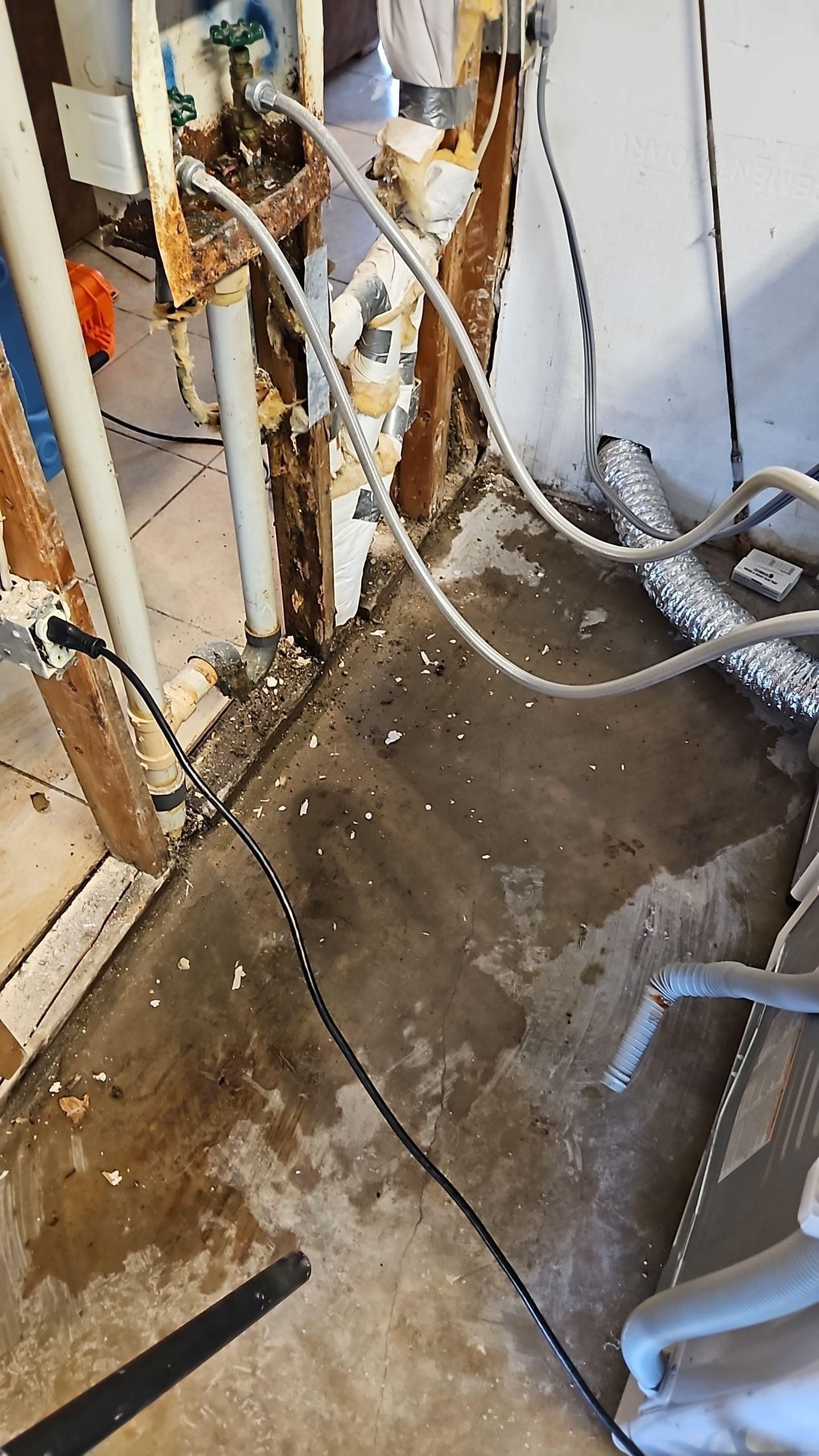 Drywall removal in sitting room after washing machine water damage
