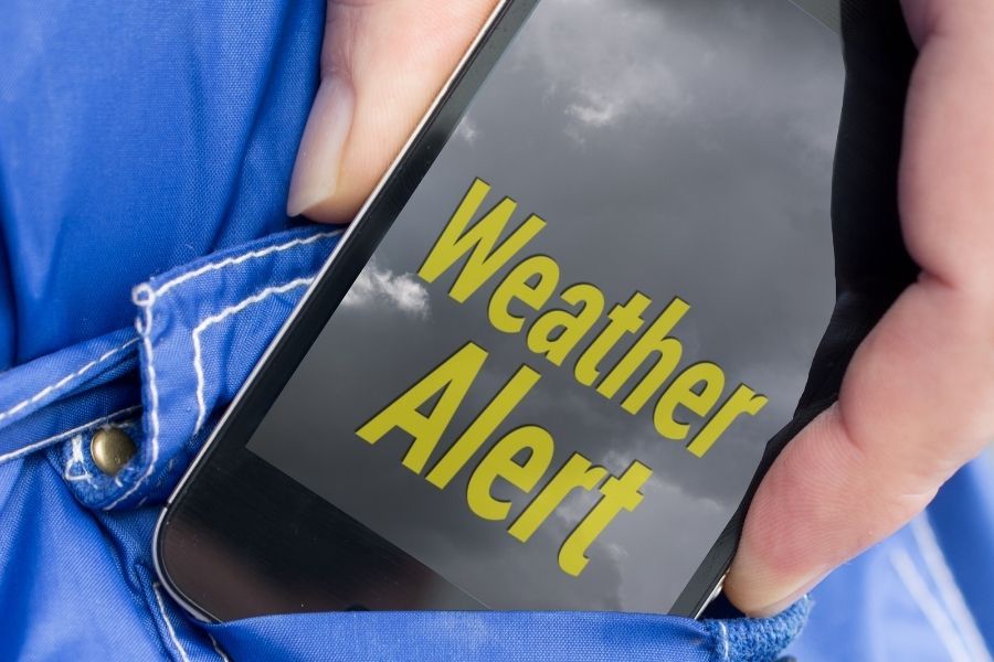 Severe weather alert notification on a screen during a Central Texas storm