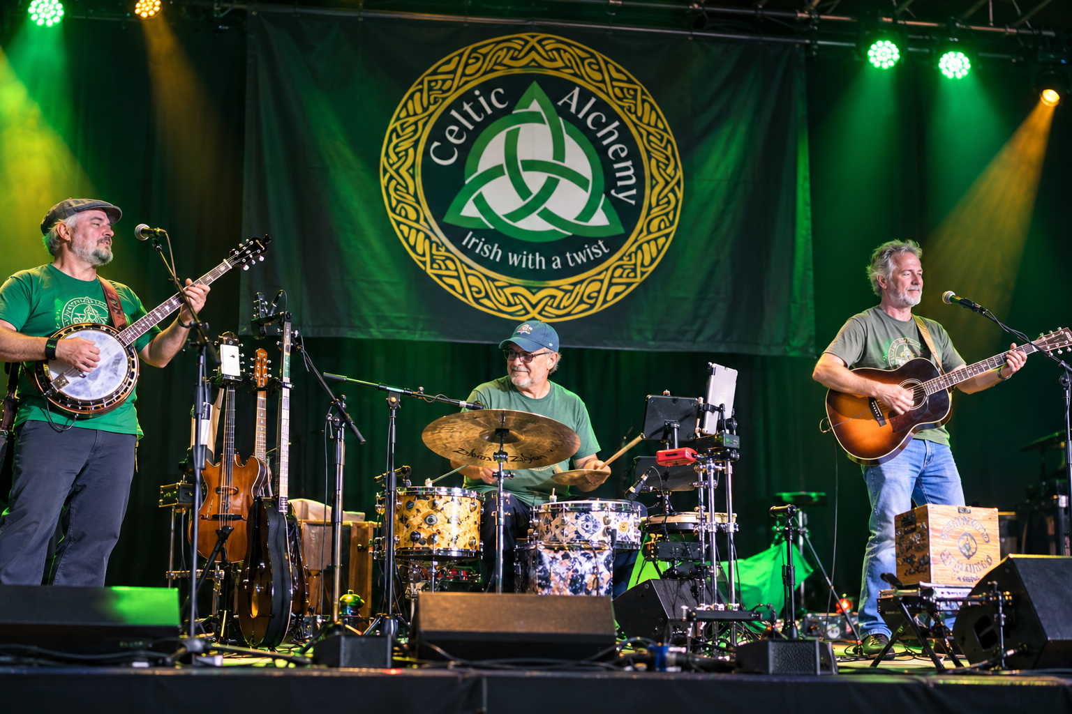 Three musicians perform onstage under green lights with a Celtic-themed banner behind them.