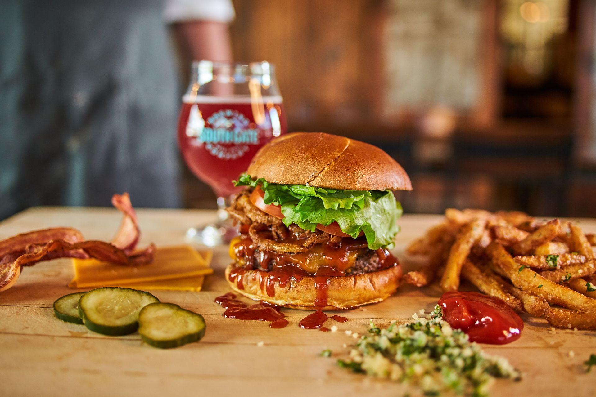 giant burger and glass of wine