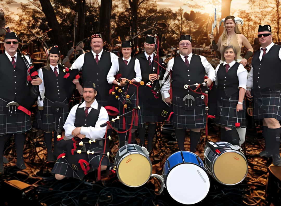 Bagpipers in black kilts and uniforms posing outdoors with drums and autumn leaves