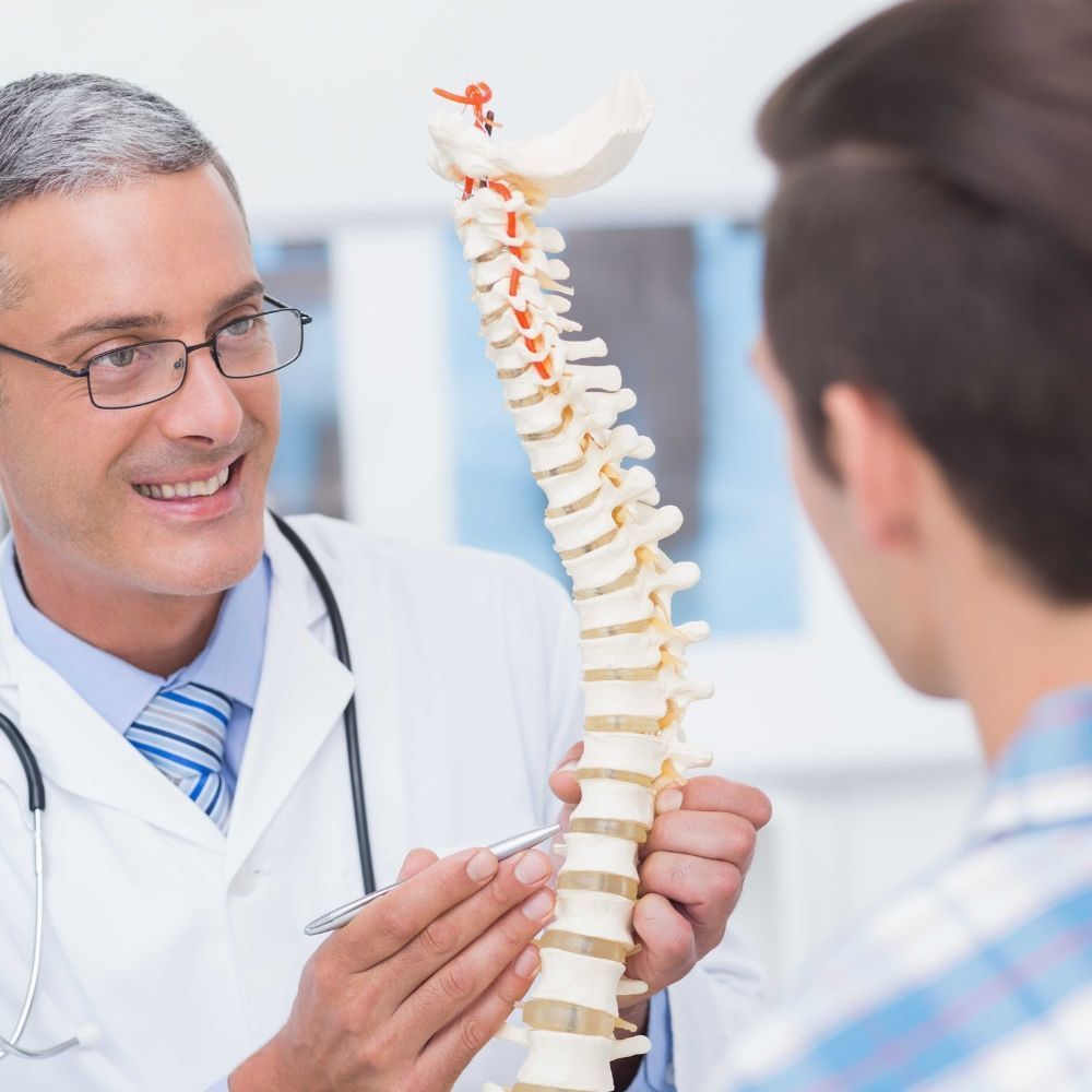 Physician back pain examination at Superior Health