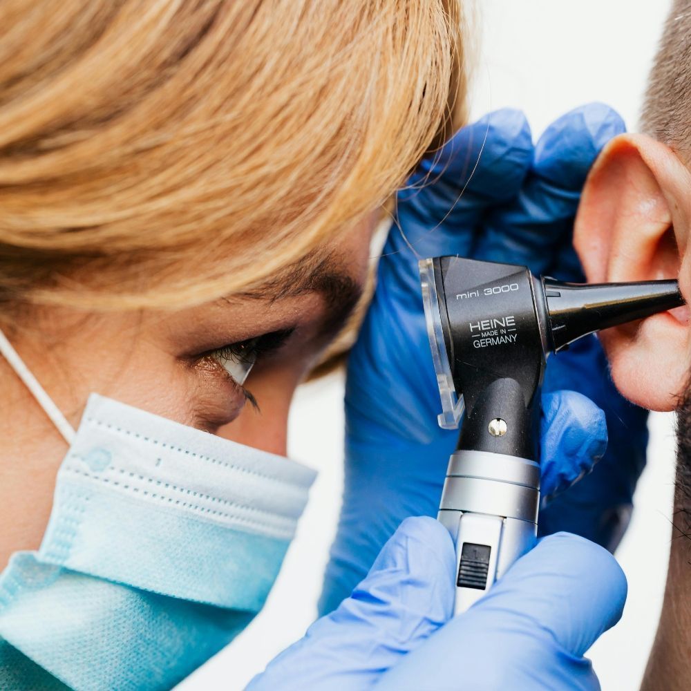 Otoscope ear examination at Superior Health Medical