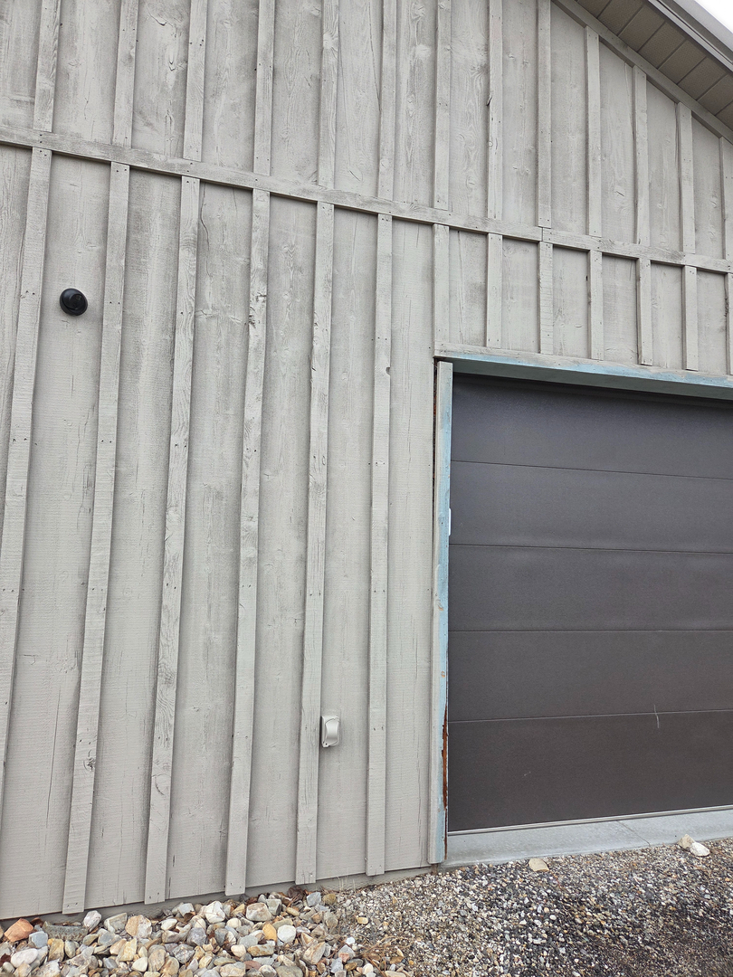 Security camera mounted on rural shop exterior in Hamilton Montana — Smart Home Solutions