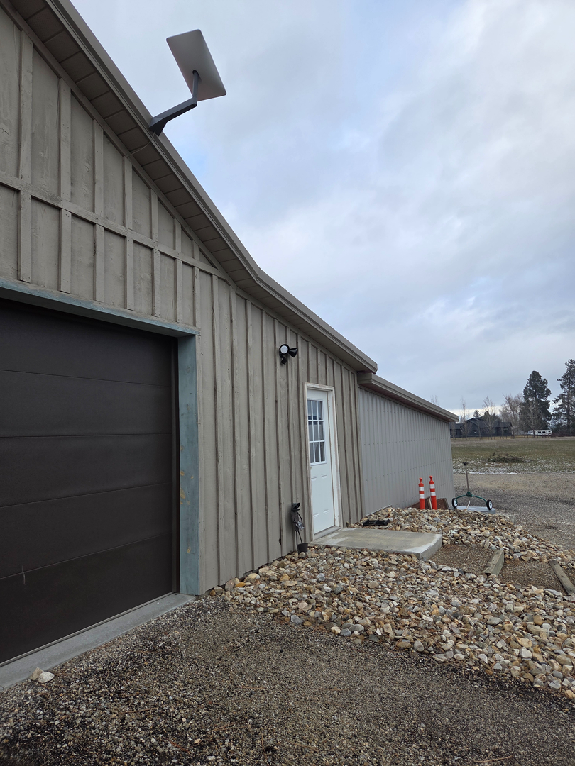 Starlink dish and Ring security camera installation on rural shop in Hamilton Montana — Smart Home Solution