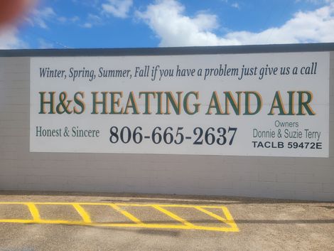 A sign for h & s heating and air says winter spring summer fall if you have a problem just give us a call A sign for h & s heating and air says winter spring summer fall if you have a problem just give us a call