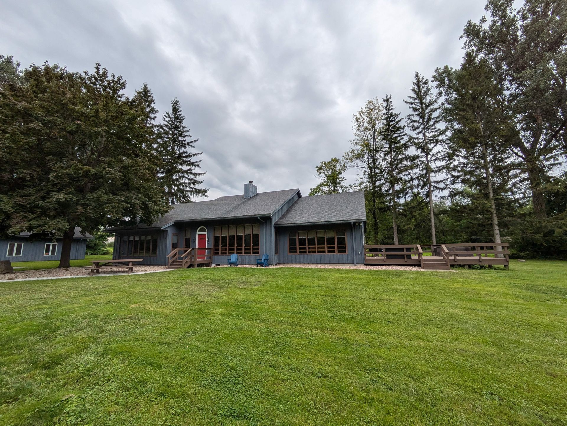 A house with a large lawn in front of it