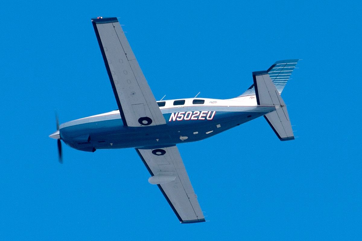 small aircraft flying N502EU