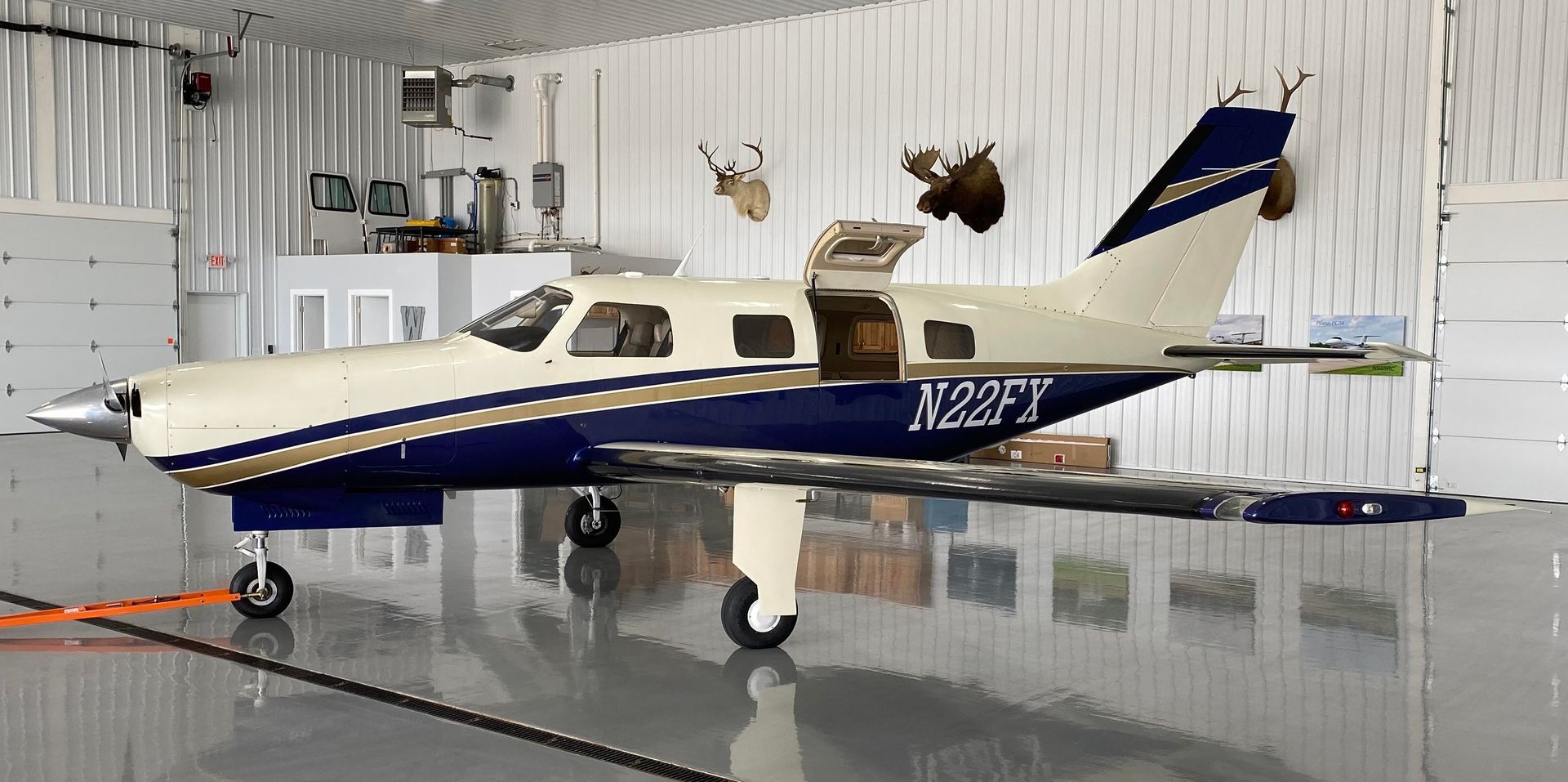 small aircraft inside storage N22FX