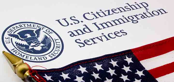 american flag under text about U.S. immigration