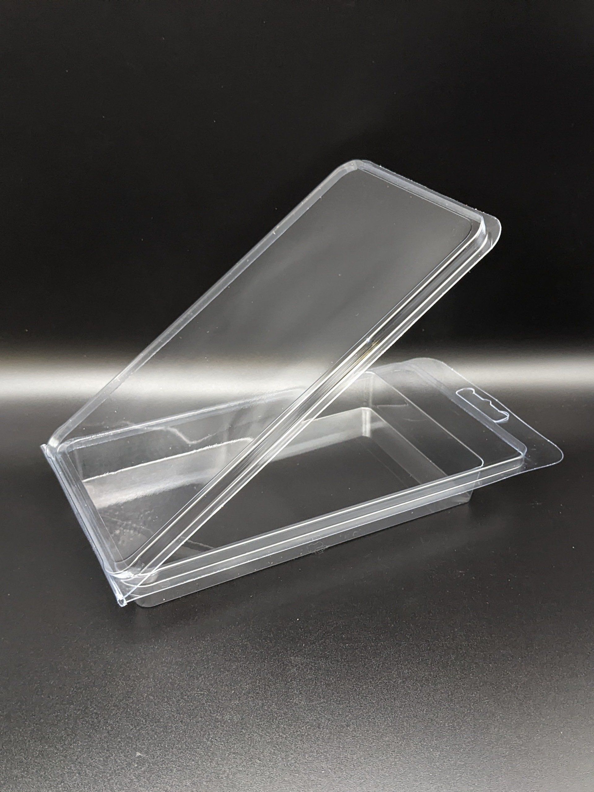 A clear plastic container with a lid is sitting on a table.