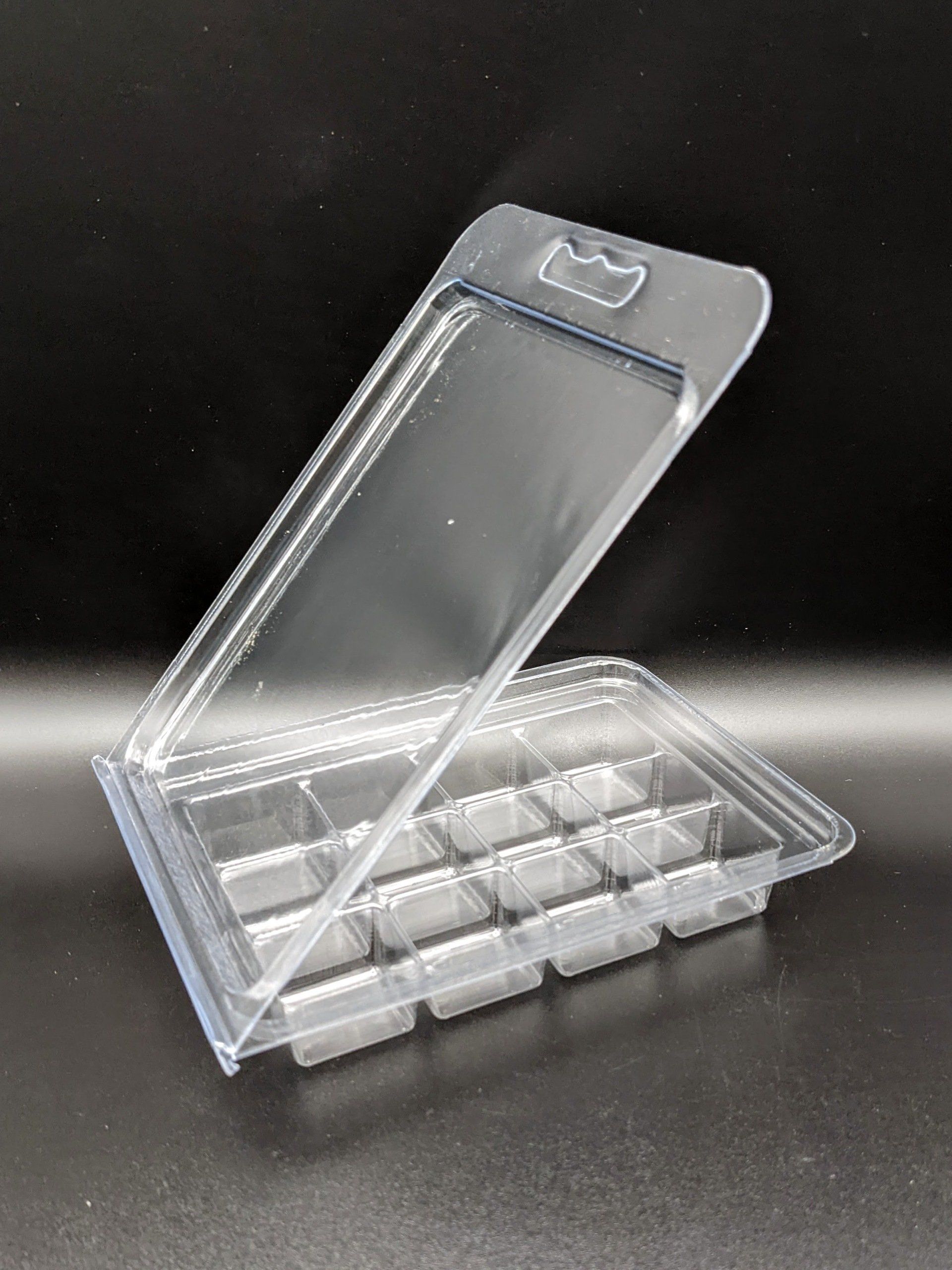 A clear plastic wax container