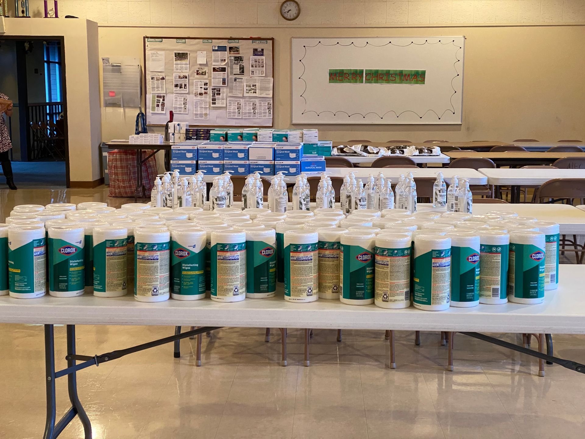 A table filled with lots of bottles of cleaning supplies