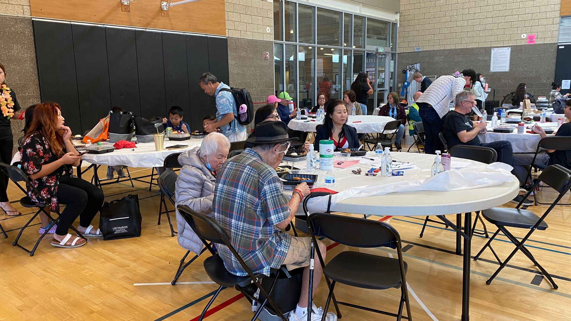 A group of people are sitting at tables in a room.