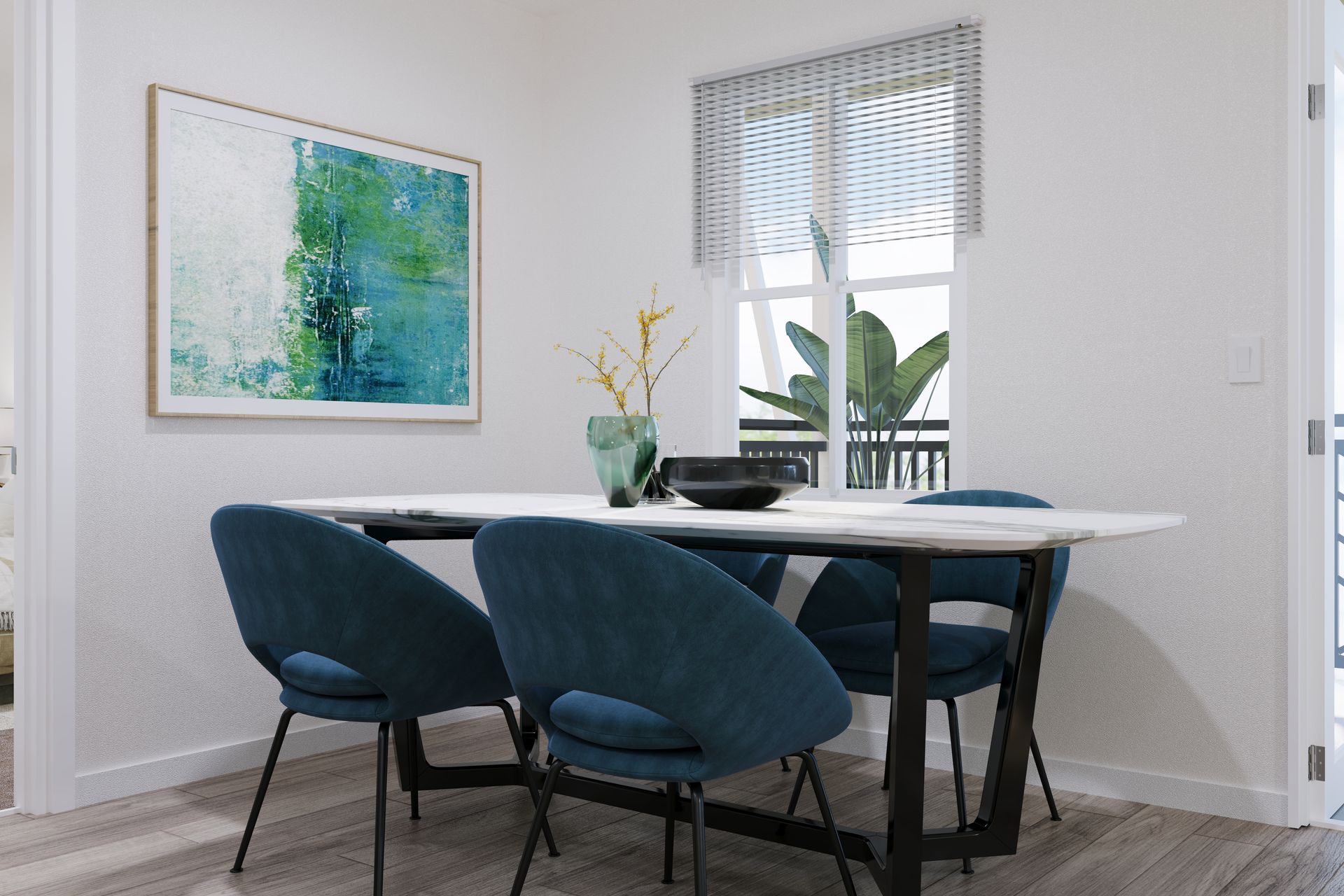 Modern dining room with blue chairs, round table, abstract wall art, and a window with blinds