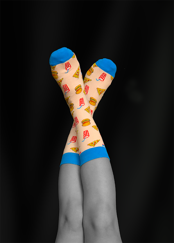 Legs crossed wearing pizza-themed socks, blue cuffs, against a black background.
