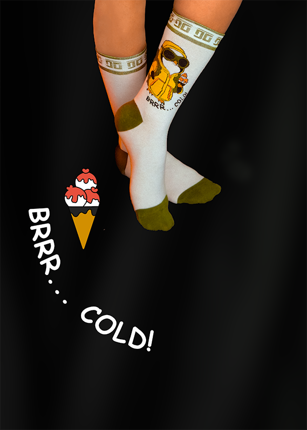 Pair of white socks with cartoon character, and ice cream cone with text