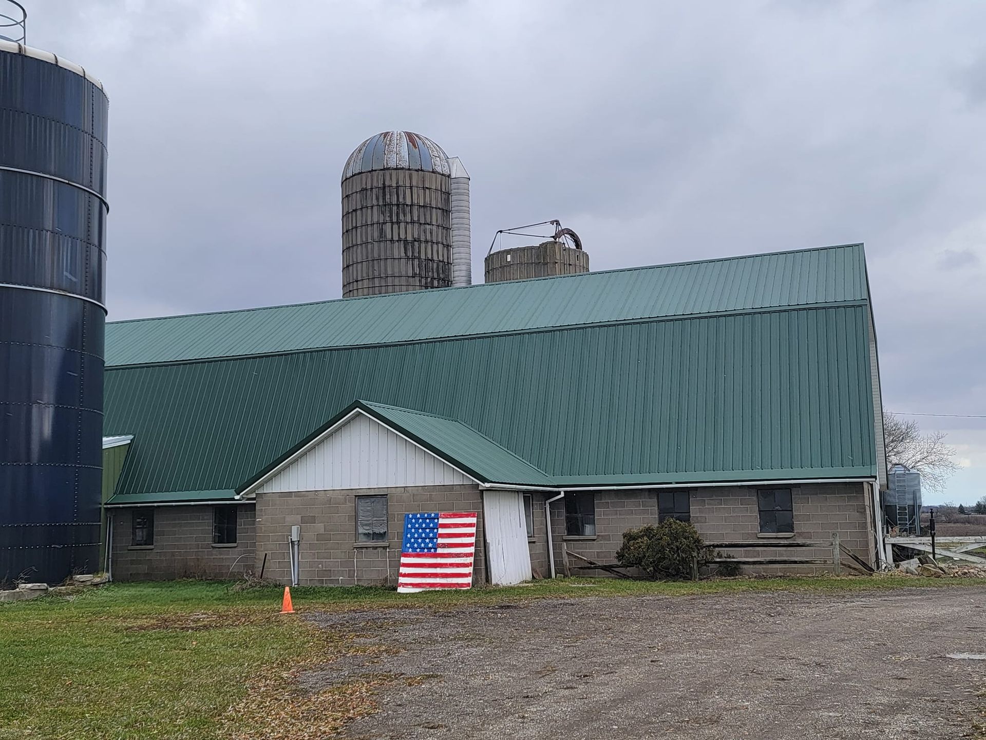Green metal roof with rounded shape building— Croswell, MI — Parraghi Roofing & Sheet Metal, LLC