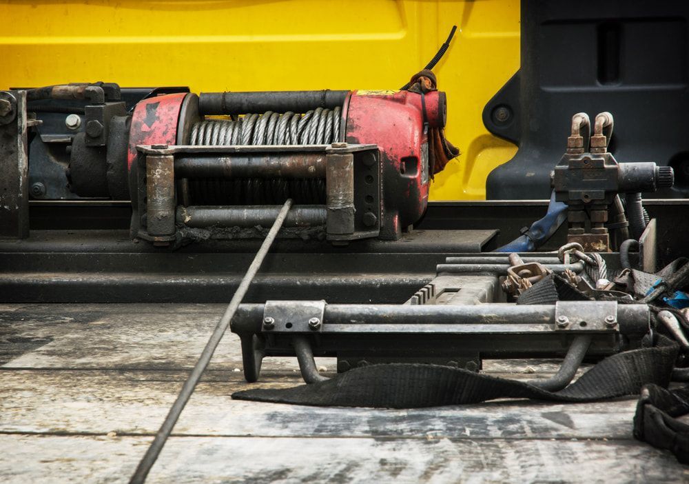 A Winch Is Sitting On The Back Of A Truck — Day & Night Towing & Transport In Ayr, QLD