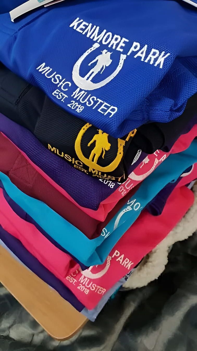 A Stack Of Shirts That Are Embroided — Gympie Embroidery Services In Southside, QLD